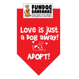 Red one size fits most dog bandana with Love is Just a Dog Away Adopt and a dog in white ink.