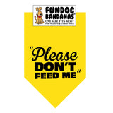Gold one size fits most dog bandana with Please Don't Feed Me in black ink.