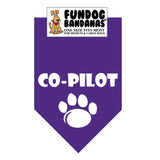 Purple one size fits most dog bandana with Co-Pilot and a paw in white ink.