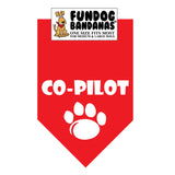 Red one size fits most dog bandana with Co-Pilot and a paw in white ink.