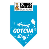 Turquoise one size fits most dog bandana with Happy Gotcha Day, a balloon and some confetti in white ink.