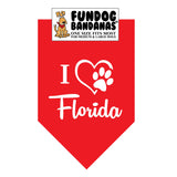 Red one size fits most dog bandana with I Heart Florida and a paw within a heart in white ink.