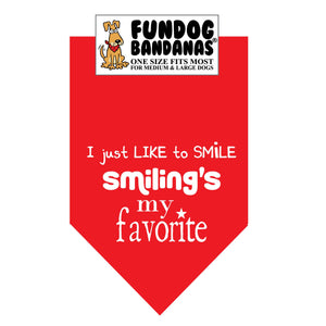 Red one size fits most dog bandana with I just like to smile, smiling's my favorite in white ink.