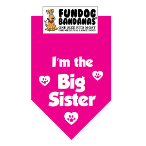 Hot Pink one size fits most dog bandana with I'm The Big Sister and paws with hearts in white ink.