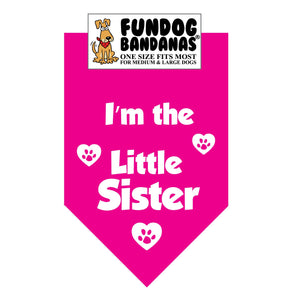 Hot Pink one size fits most dog bandana with I'm the Little Sister and paws within hearts in white ink.
