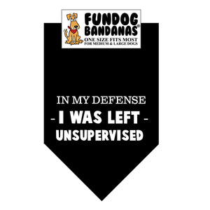 Black one size fits most dog bandana with In My Defense I was Left Unsupervised in white ink.