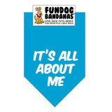 Turquoise one size fits most dog bandana with It's All About Me in white ink.