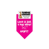 Hot Pink miniature dog bandana with Love is Just a Dog Away Adopt and a dog in white ink.