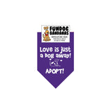 Purple miniature dog bandana with Love is Just a Dog Away Adopt and a dog in white ink.