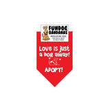 Red miniature dog bandana with Love is Just a Dog Away Adopt and a dog in white ink.