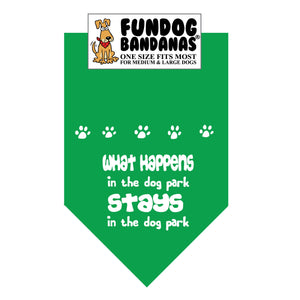 Kelly Green one size fits most dog bandana with What Happens in the dog park Stays in the dog park in white ink.